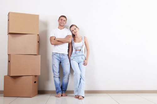 Removal team handling house move logistics in Docklands apartment building