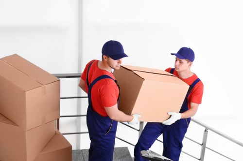 Docklands apartment moving scene with removalists near high-rise residential buildings