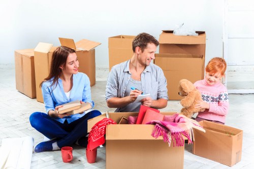 Docklands flat move with careful loading near a high-rise building