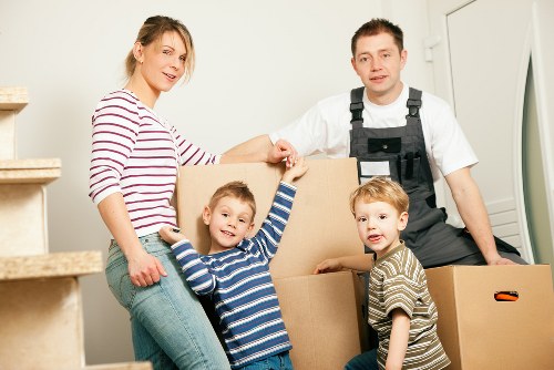 House movers loading furniture in a Docklands apartment move