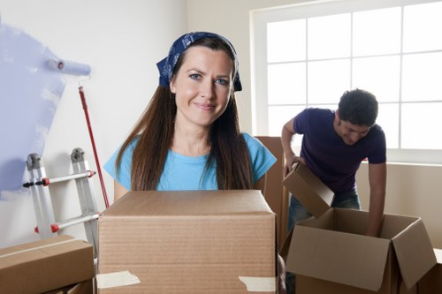 Local home removals team handling household items in a Docklands setting