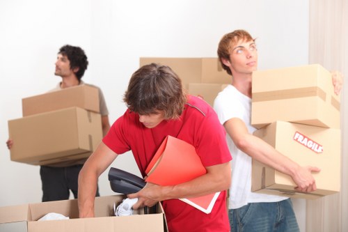 Packed boxes and furniture in a Docklands high-rise lobby