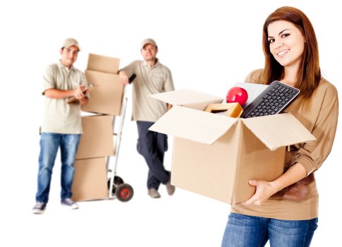 Professional movers handling boxes and furniture for a Docklands relocation