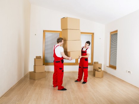 Local removals team handling boxes and home items